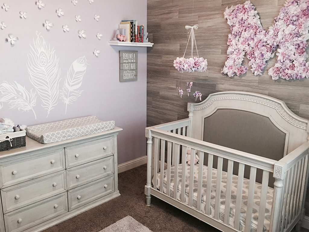 A beautiful flower themed nursery in beige and pink.