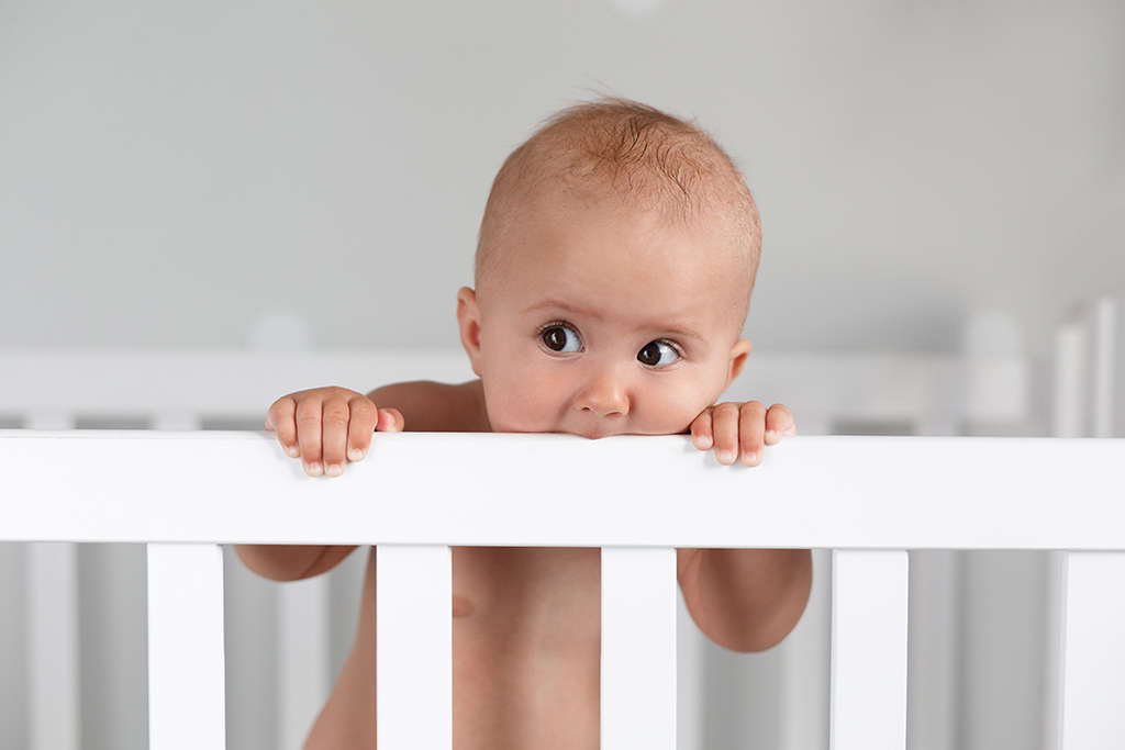 Baby Chewing on Crib Baby Chewing on Crib